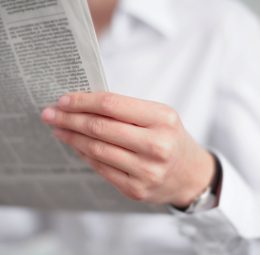 businesswoman reading newspaper